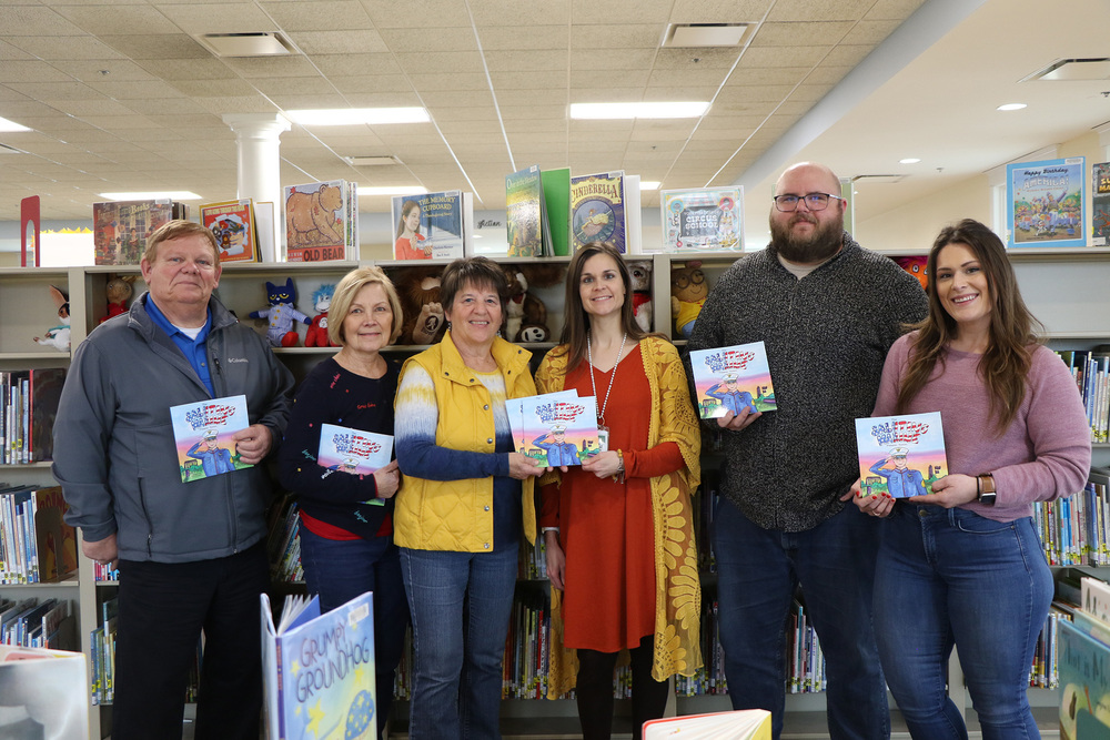 Local librarians post for a photo with Sharon Giesler with the VFW Auxiliary