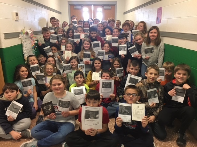 The students pose for a group photo.