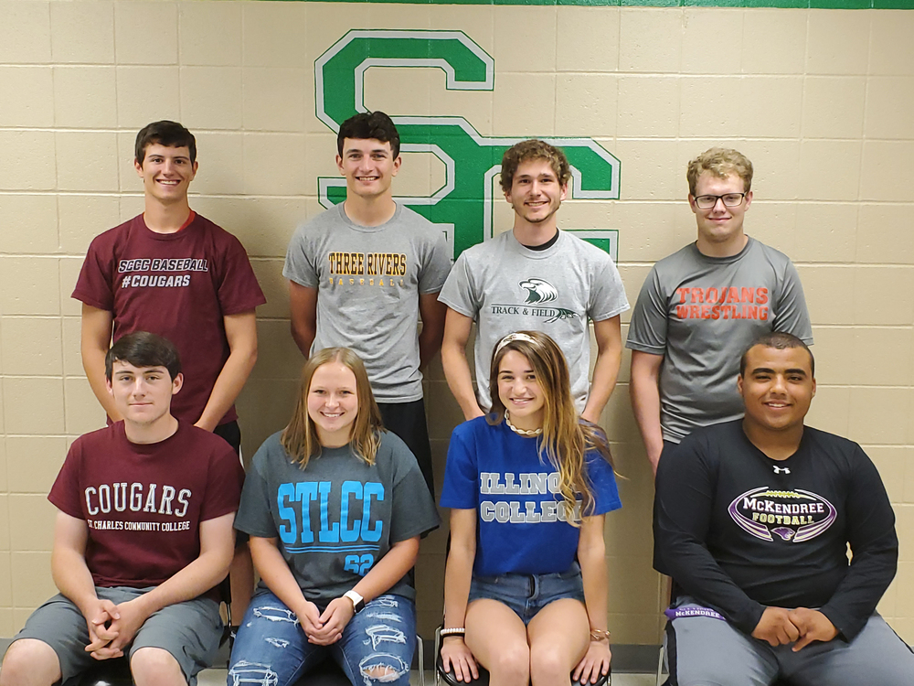 The students pose for a group photo.