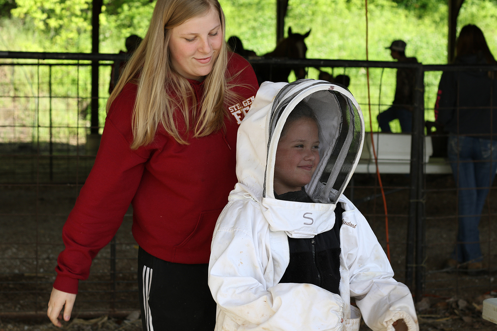 A student wears a bee suit.
