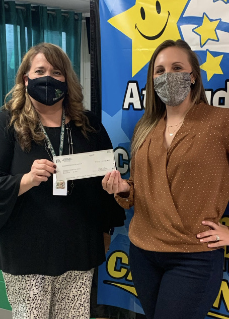 Mrs. Zuspann receiving $604 check.